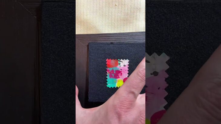 placing NFT stamps [Liaksiej.Philately] in wooden frames.